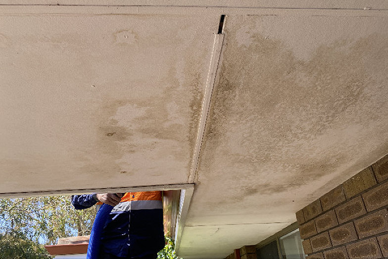 Water stains and ceiling damage caused by blocked gutters